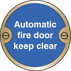 59124 Automatic fire door keep clear 76mm dia brass sign (76mm dia) Safety Sign