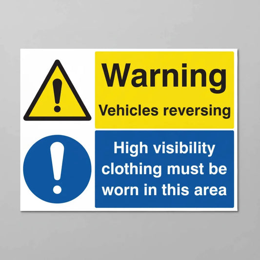Warning vehicles reversing high visibility clothing must be worn in this area