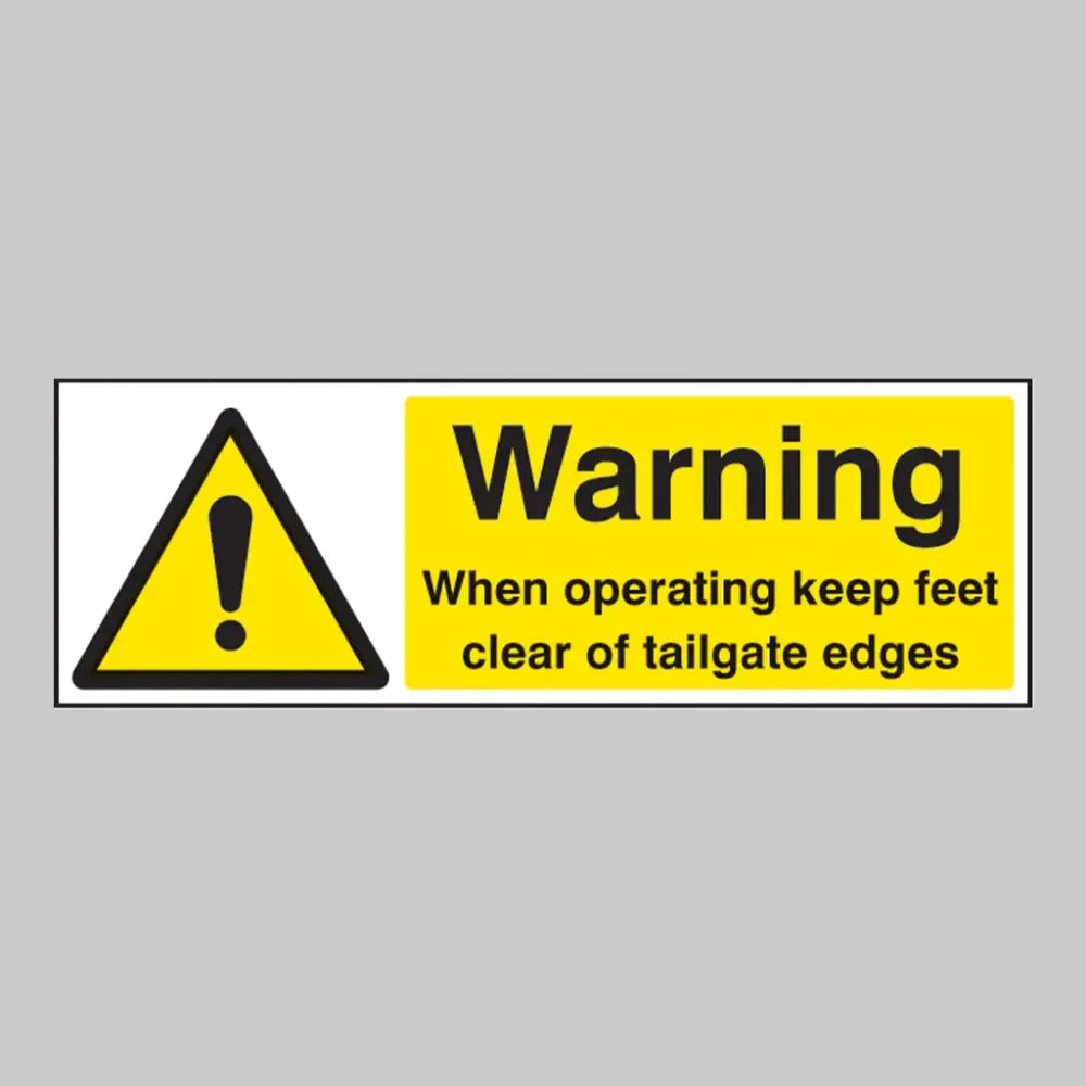 Warning when operating keep feet clear of tailgate edges