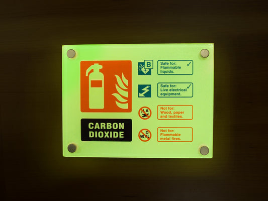 Fire ID - CO2 visual impact photoluminescent sign 200x150mm c/w stand off locators