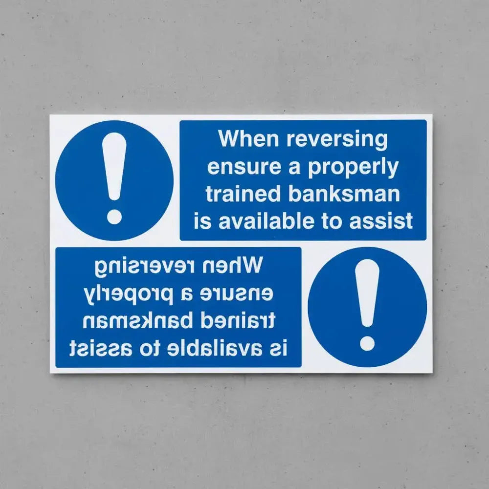 When reversing ensure properly trained banksman available reflection sign