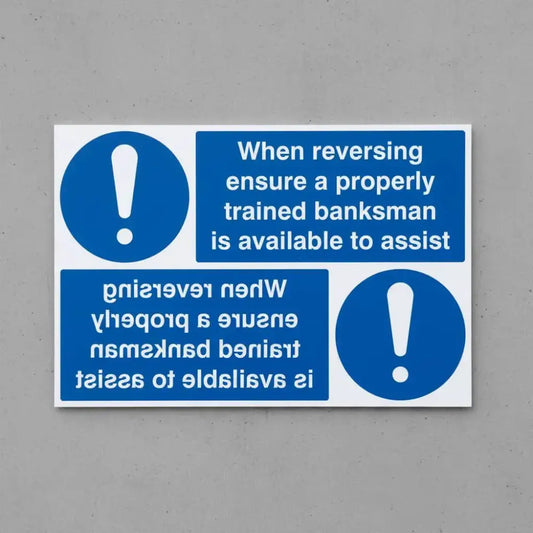 When reversing ensure properly trained banksman available reflection sign