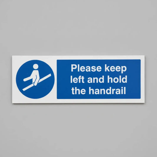 25488G Please keep left and hold the handrail Self Adhesive Vinyl (300x100mm) Safety Sign