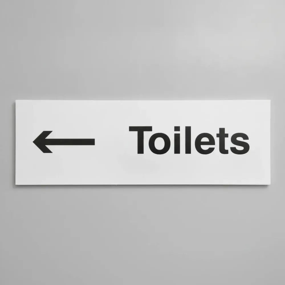 77051L Toilets arrow left Ultra Durable 2mm PET (450x150mm) Safety Sign