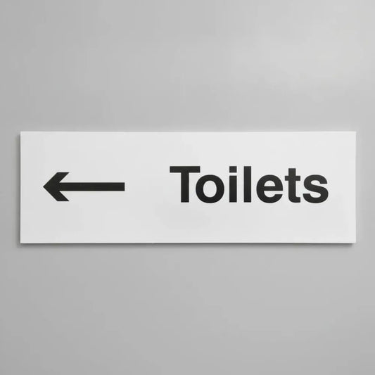 77051L Toilets arrow left Ultra Durable 2mm PET (450x150mm) Safety Sign