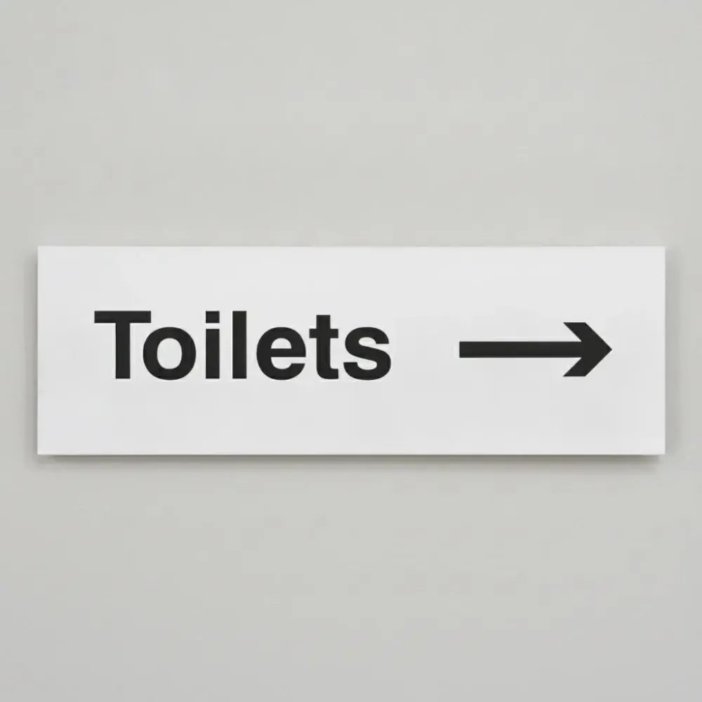 77053G Toilets arrow right Ultra Durable 2mm PET (300x100mm) Safety Sign