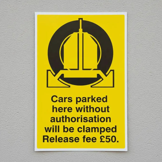 Cars parked here without authorisation will be clamped release fee £50